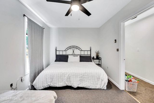 bedroom featuring ceiling fan and carpet floors