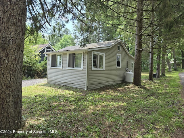 view of property exterior featuring a yard