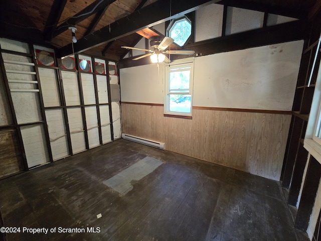 garage with ceiling fan, wood walls, wooden ceiling, and a baseboard radiator