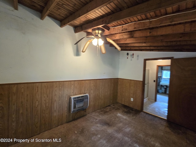 spare room with beam ceiling, heating unit, ceiling fan, and wooden ceiling