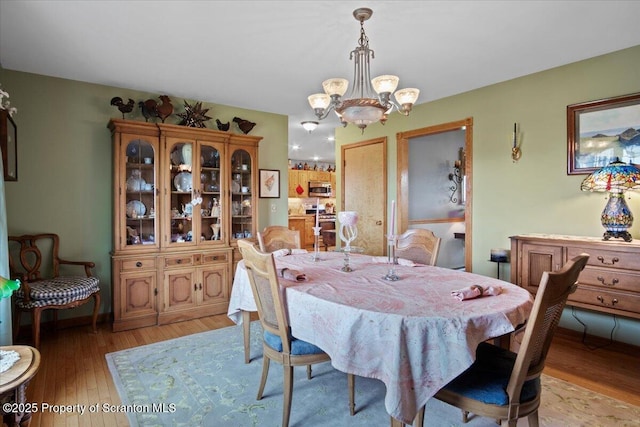 2748 Pennay Hill Rd, Kingsley, PA 18826 - dining space with a chandelier and light wood-type flooring