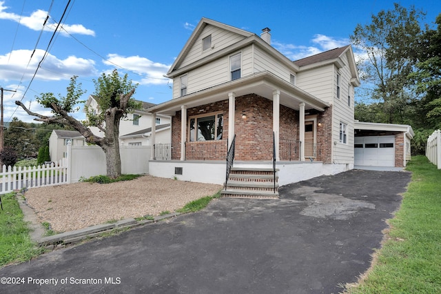 view of front of property with a porch and a garage