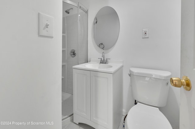 bathroom with a shower, vanity, and toilet