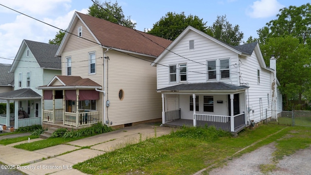 121 Throop St, Scranton, PA 18508 - view of front facade featuring a porch, a chimney, and roof with shingles