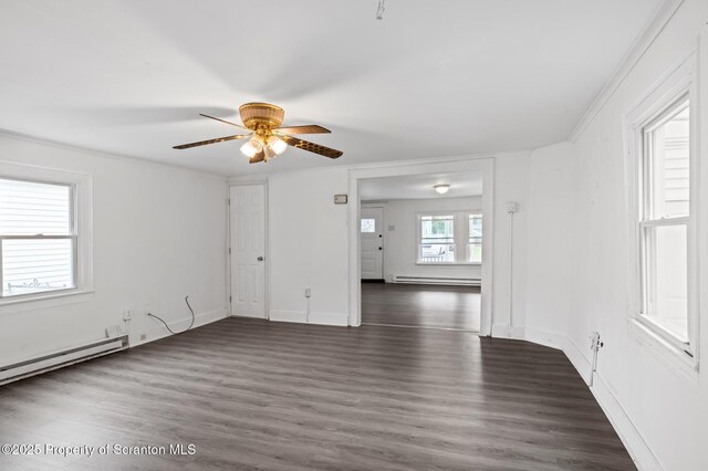 121 Throop St, Scranton, PA 18508 - unfurnished room featuring baseboard heating, a ceiling fan, and dark wood-style flooring