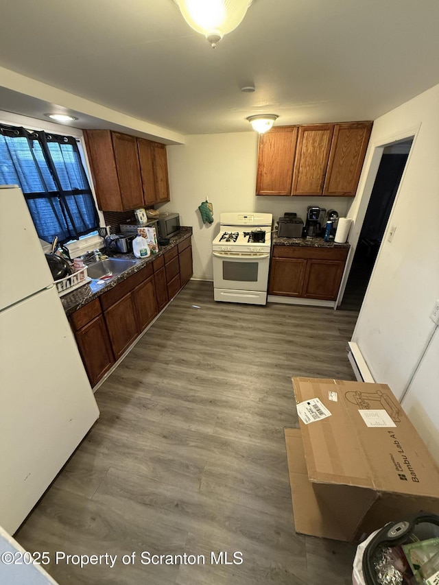 121 Throop St, Scranton, PA 18508 - kitchen featuring stainless steel microwave, a sink, white gas stove, and wood finished floors