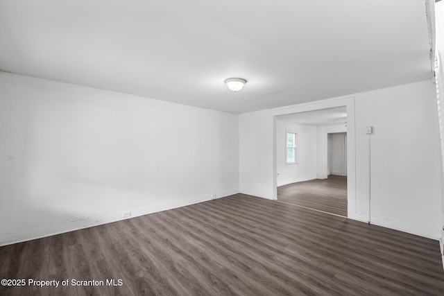 121 Throop St, Scranton, PA 18508 - empty room with dark wood-type flooring and baseboards