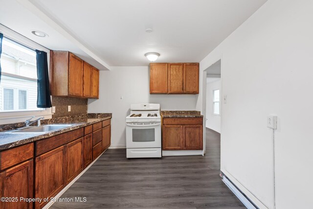121 Throop St, Scranton, PA 18508 - kitchen featuring white range with gas cooktop, a sink, dark countertops, and dark wood-style floors