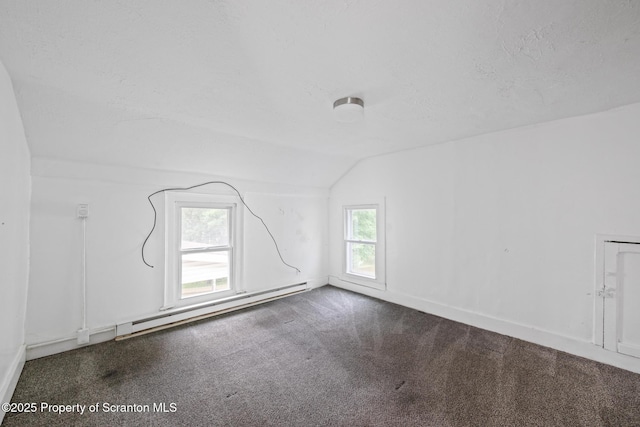 121 Throop St, Scranton, PA 18508 - empty room with vaulted ceiling, a baseboard heating unit, carpet floors, and baseboards