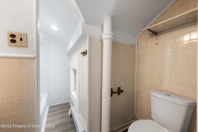 121 Throop St, Scranton, PA 18508 - bathroom featuring tile walls, wood finished floors, toilet, and a bath