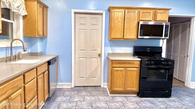 kitchen featuring appliances with stainless steel finishes and sink