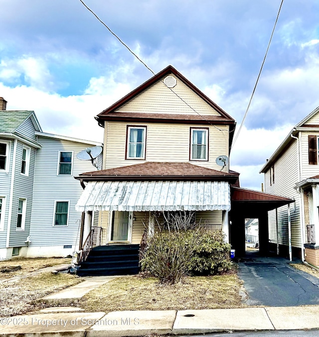 view of front of property with a carport