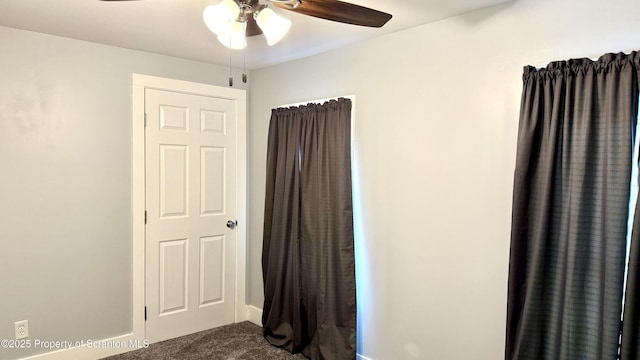 unfurnished bedroom featuring carpet floors and ceiling fan