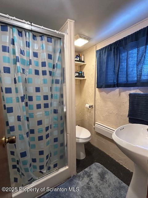 bathroom featuring baseboard heating, toilet, and a shower with shower curtain