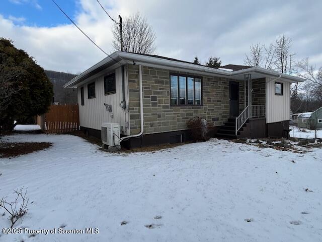 view of front of property with ac unit