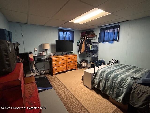 bedroom with a paneled ceiling