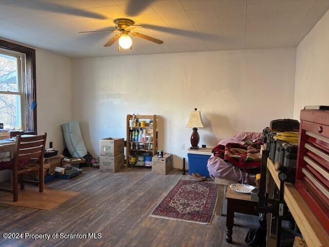 interior space with dark hardwood / wood-style flooring and ceiling fan