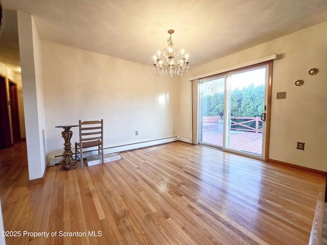 unfurnished dining area with baseboard heating, light wood-type flooring, a chandelier, and baseboards