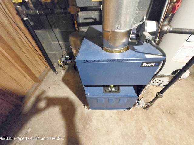 details featuring concrete flooring and a heating unit