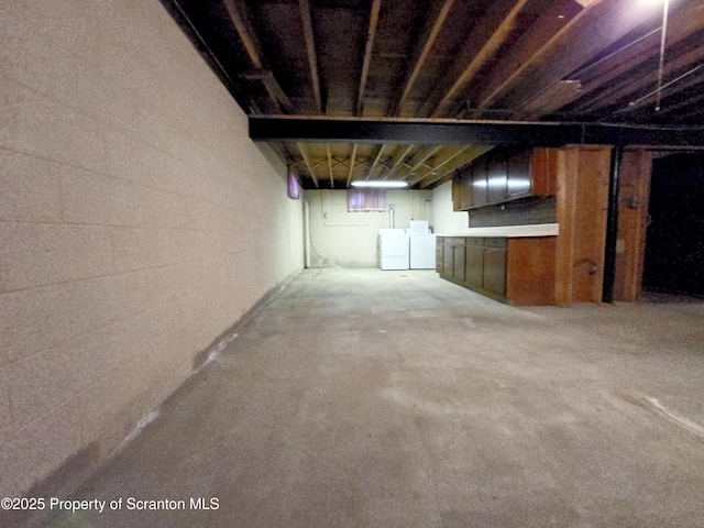 unfinished below grade area with independent washer and dryer
