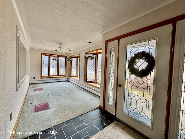 foyer featuring stone finish flooring, crown molding, dark carpet, and a textured ceiling