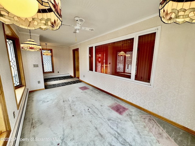 spare room featuring wallpapered walls, baseboards, a baseboard radiator, ornamental molding, and carpet