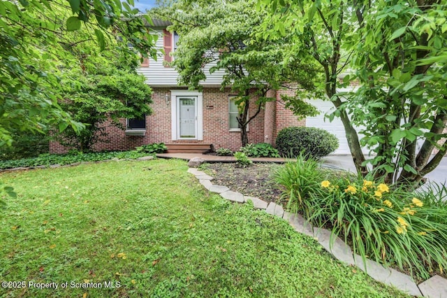 607 Pamela Dr, South Abington Twp, PA 18411 - view of front of property featuring brick siding, a front yard, and an attached garage
