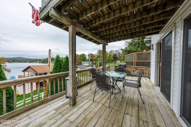 deck featuring a water view