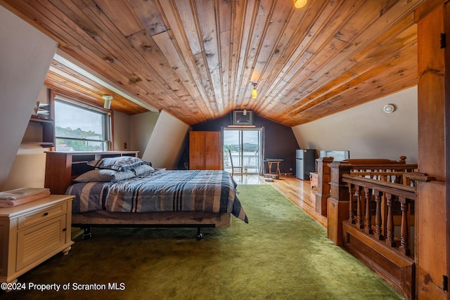 carpeted bedroom with lofted ceiling and wood ceiling