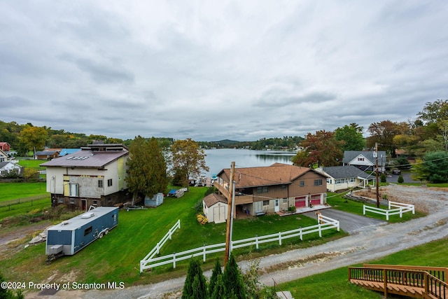 birds eye view of property with a water view