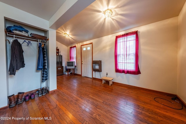 interior space featuring hardwood / wood-style floors and lofted ceiling