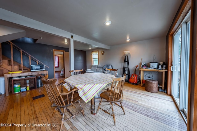 dining space featuring light wood-type flooring