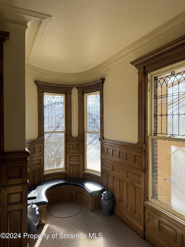 unfurnished room with crown molding