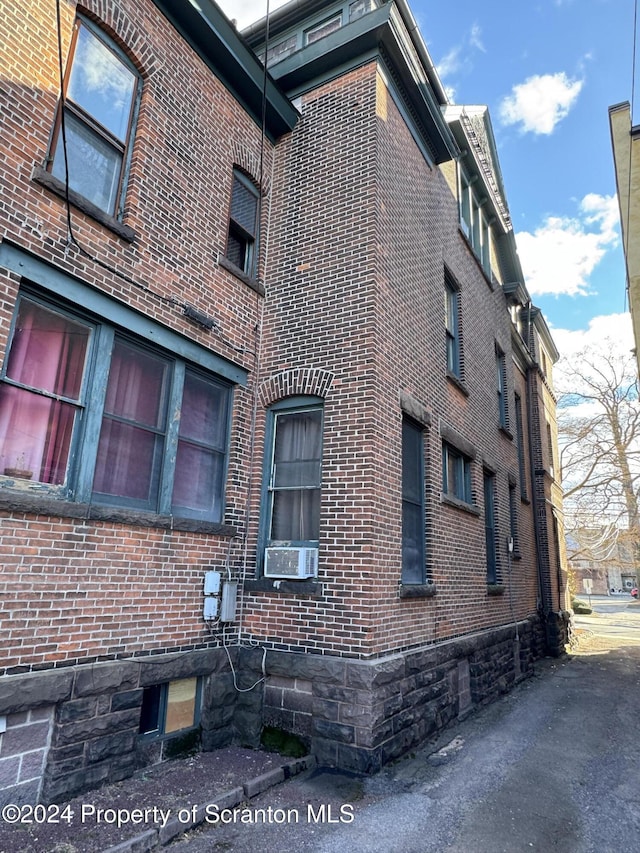 view of home's exterior with cooling unit