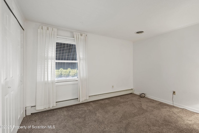 unfurnished room with a baseboard radiator, carpet, visible vents, and ornamental molding