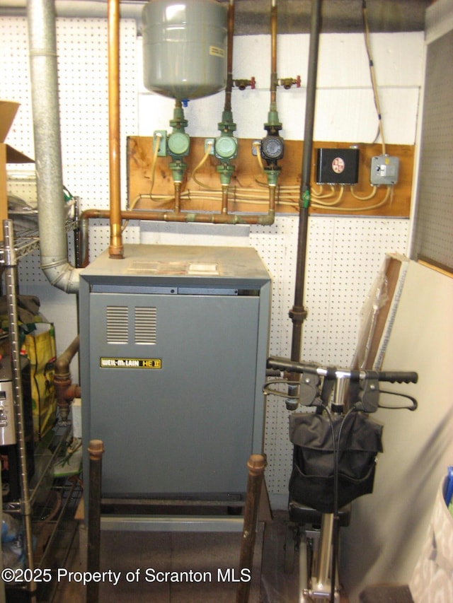 utility room featuring a heating unit