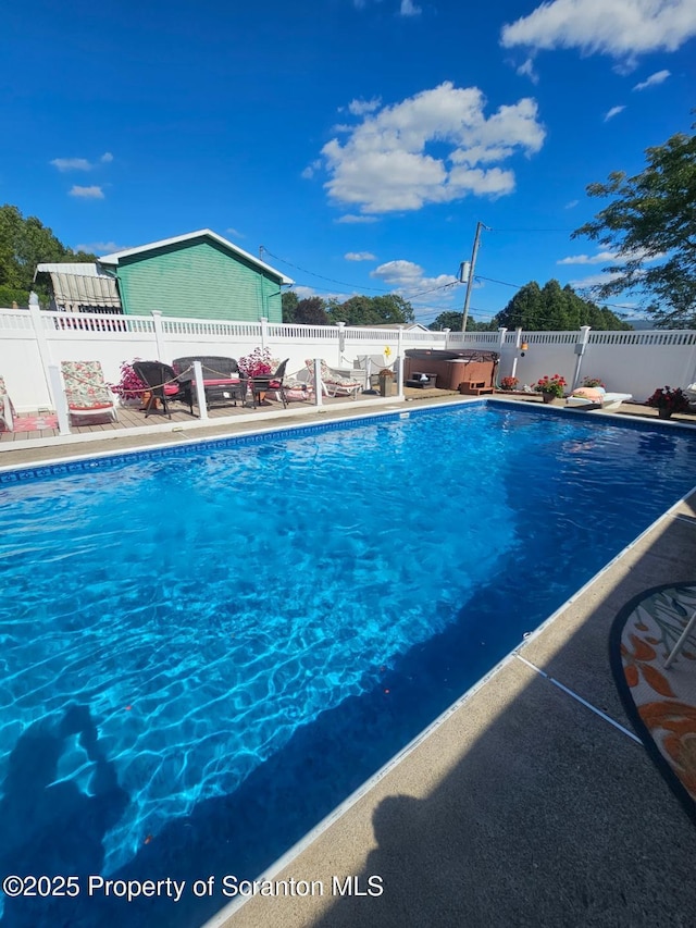 view of pool with a patio, a fenced in pool, and a fenced backyard