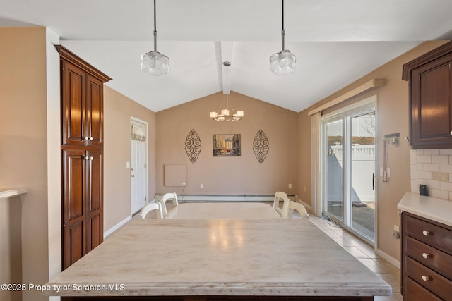 kitchen featuring backsplash, light countertops, vaulted ceiling with beams, and hanging light fixtures