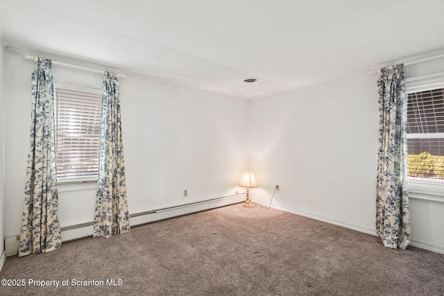 carpeted empty room featuring visible vents and a textured ceiling