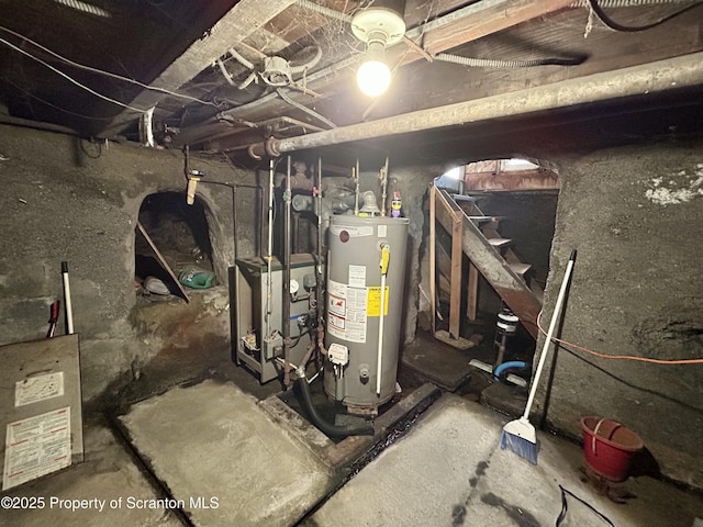 utility room featuring a heating unit and gas water heater