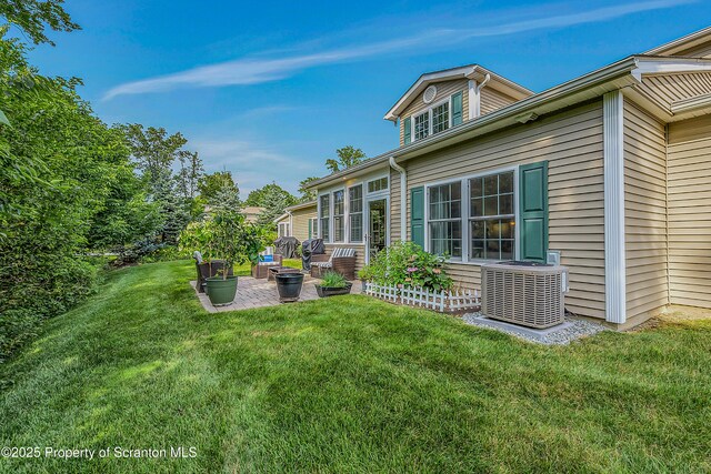 129 Wyndham Rd, South Abington Twp, PA 18411 - view of grassy yard featuring a patio