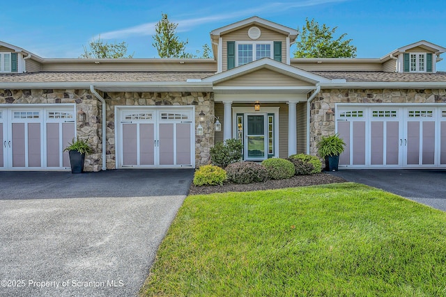129 Wyndham Rd, South Abington Twp, PA 18411 - view of front of home featuring stone siding and a front lawn