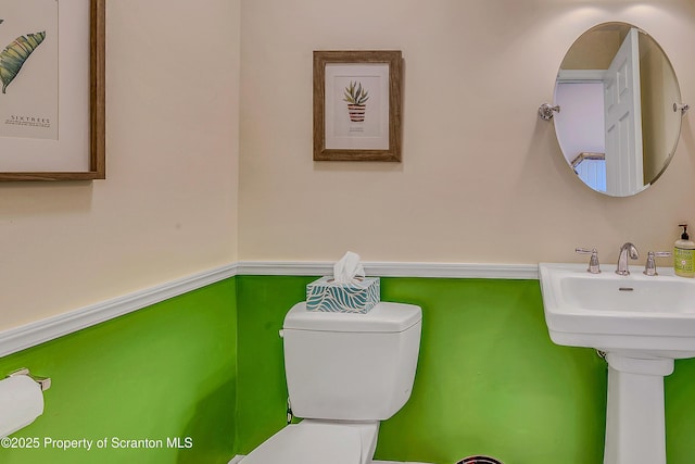129 Wyndham Rd, South Abington Twp, PA 18411 - half bathroom featuring toilet and a sink