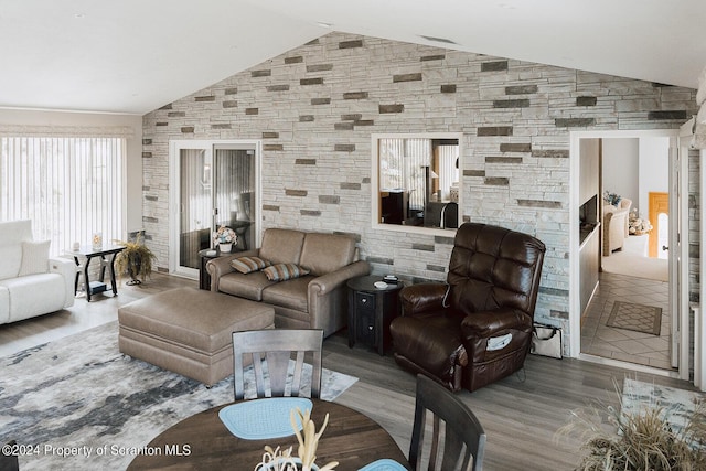 living room featuring hardwood / wood-style flooring and lofted ceiling