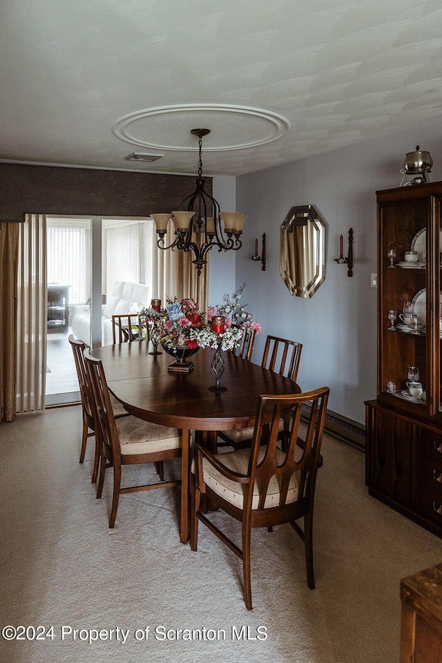 dining space with a notable chandelier, light carpet, and a baseboard radiator