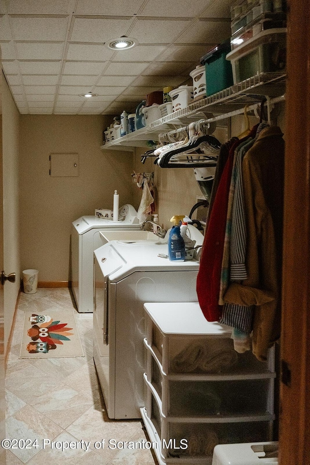 washroom with washing machine and clothes dryer