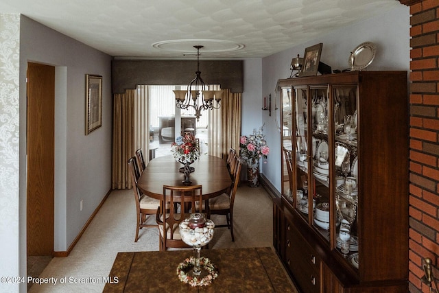 carpeted dining area with a notable chandelier