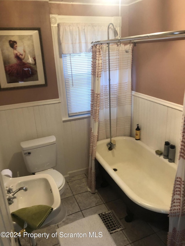 bathroom with tile patterned flooring, toilet, and shower / tub combo with curtain