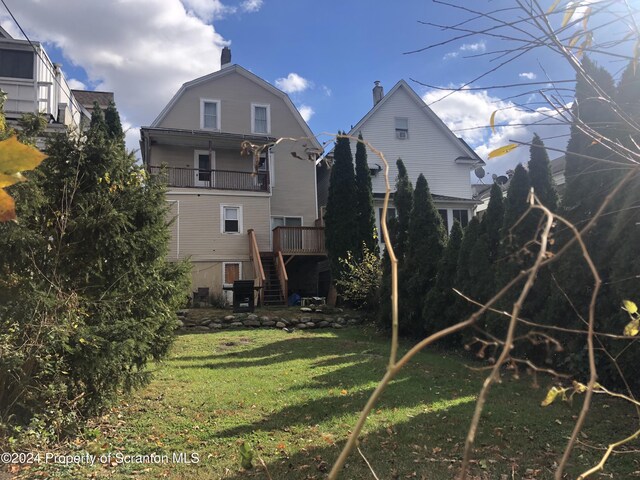 825 Prescott Ave, Scranton, PA 18510 - view of grassy yard with stairway, a balcony, and a deck