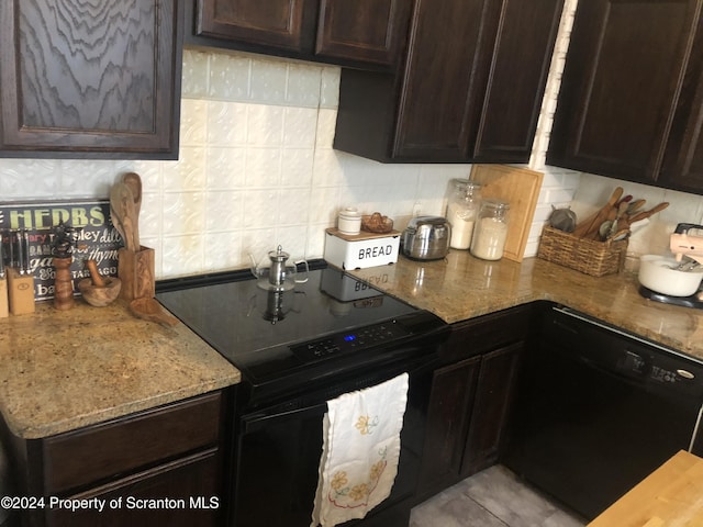 kitchen with decorative backsplash, dark brown cabinets, light stone counters, and black appliances